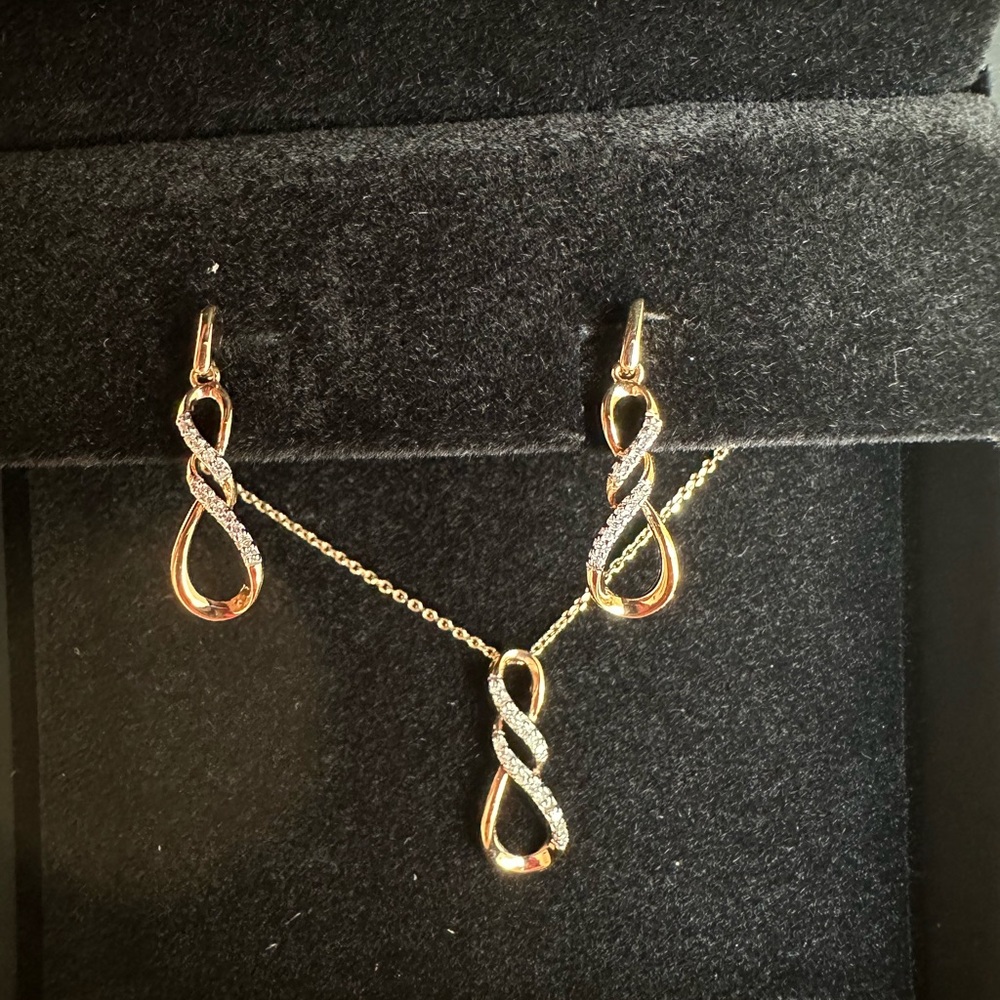 Diamond Infinity earrings and necklace. It’s from Jared!